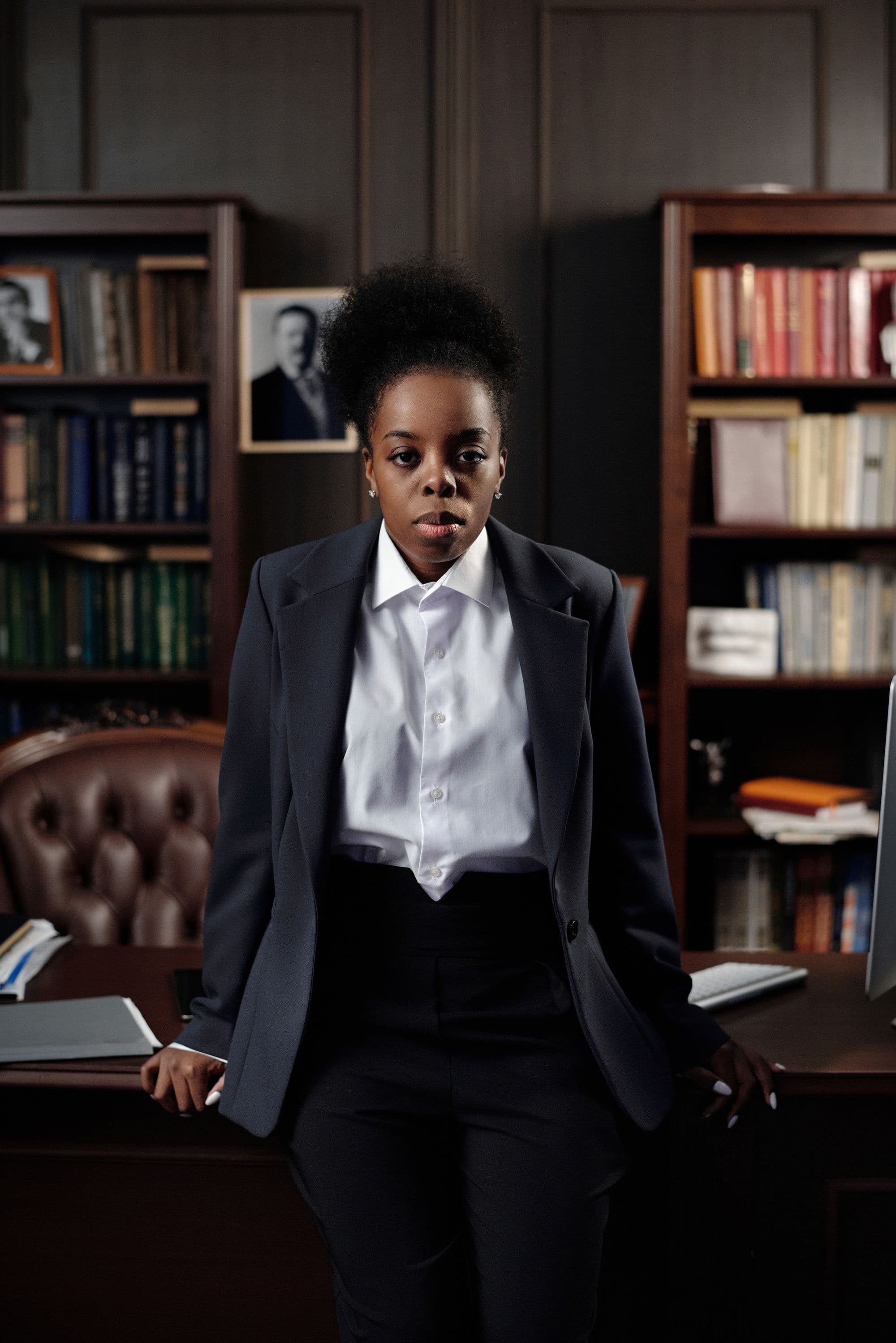 A professional woman standing in an office